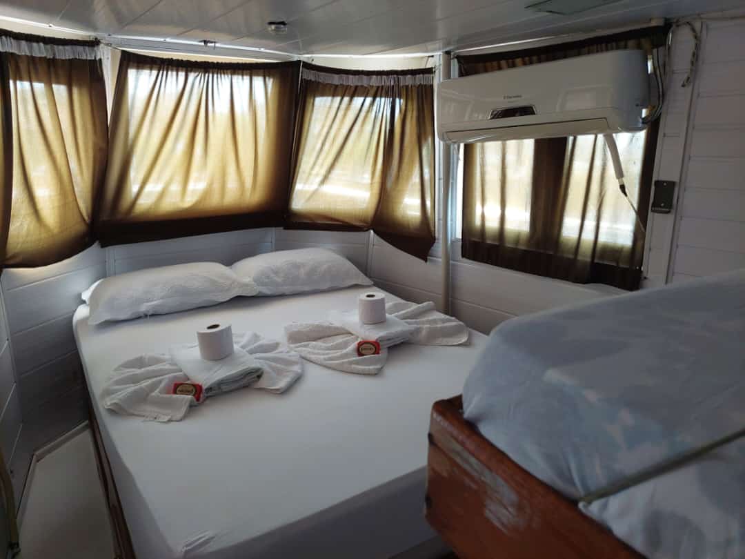 A bright cabin and dining space inside the regional boat