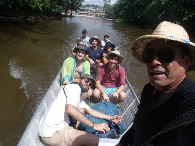 Guests and their local guide exploring by canoe